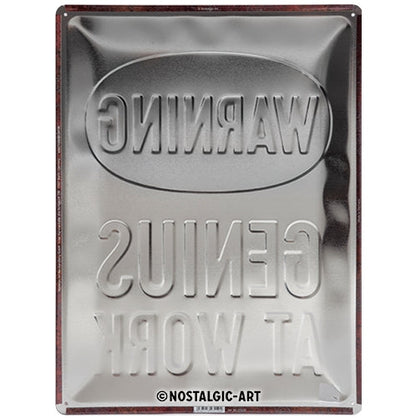 Genius at Work - Skilti